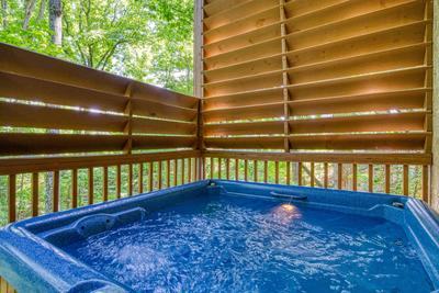 Forest Hollow lower level deck with hot tub