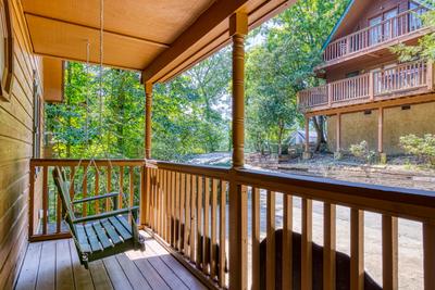 Forest Hollow swing on covered entry deck