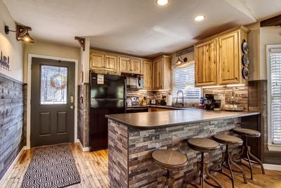 The Playful Bear fully furnished kitchen and bar top with stools