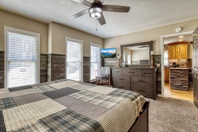 The Playful Bear main level bedroom with 32 inch TV and king size bed