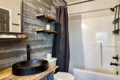 The Playful Bear main level bathroom two with tub/shower combo