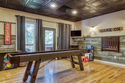 The Playful Bear shuffle board in lower level game room 