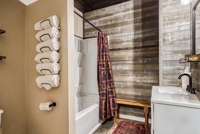 The Playful Bear lower level bathroom with tub/shower combo