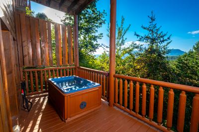 Lower Level covered deck with hot tub overlooking the Smoky Mountain Views