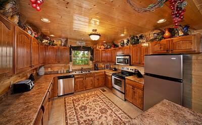 Kitchen area inside 8 bedroom Pigeon Forge cabin Cades Cove Castle
