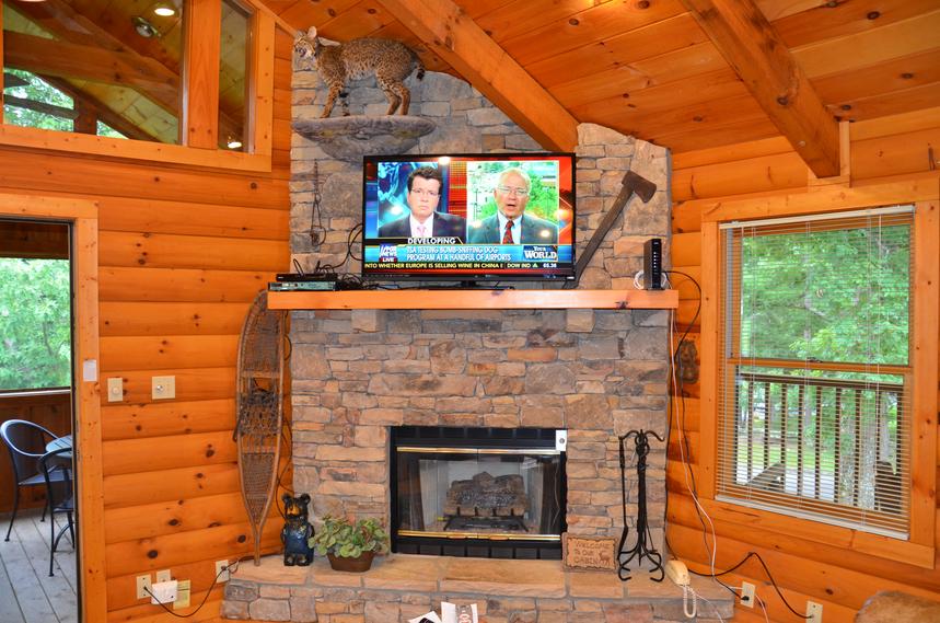 Gas fireplace and flat screen TV on the top floor