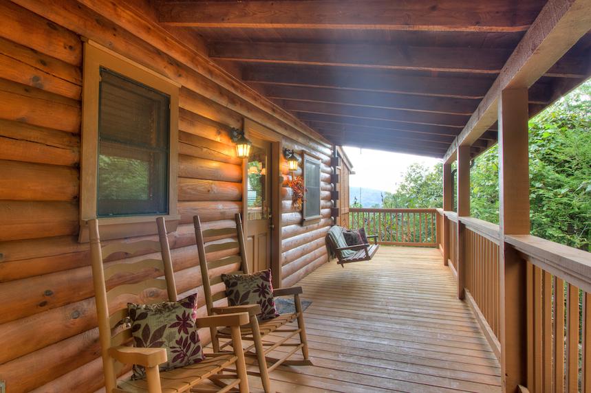 Front porch of this 2 bedroom cabin convenient to both Pigeon Forge and Gatlinburg