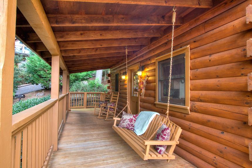 Wooden porch swing on the front porch