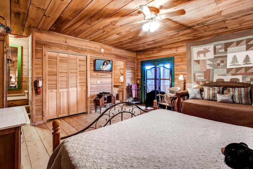 Master bedroom with king bed and flat screen TV