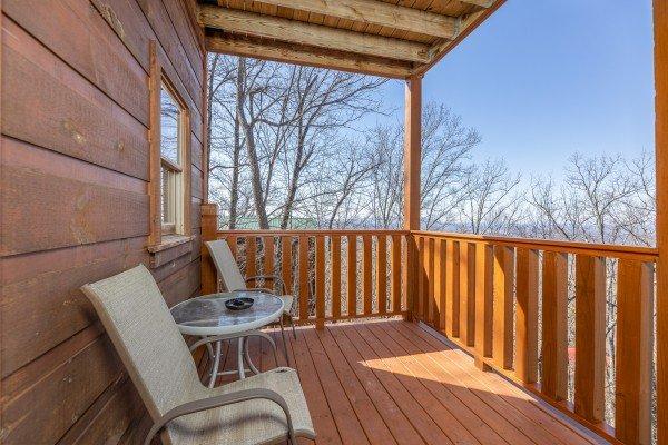 Second alternate deck area with chairs and table