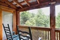Screened in porch and rocking chairs