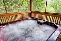 Relaxing hot tub on the deck of Bear Pause cabin in Pigeon Forge