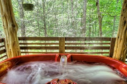 hot tub of this 1 bedroom cabin in between Gatlinburg and Pigeon Forge