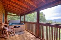Hot tub on the deck with wooden rocking chair