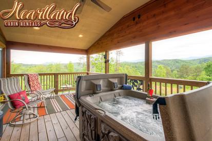 Hot tub and chairs with amazing views of the mountains