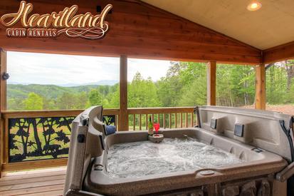 Hot tub at this pet friendly cabin in Pigeon Forge