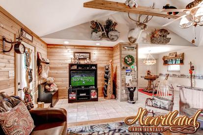 Living area with large TV in this 1 bedroom Pet Friendly Cabin