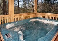 Soak in the hot tub of this honeymoon cabin