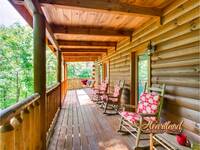 Wooden rocking chairs and a porch swing