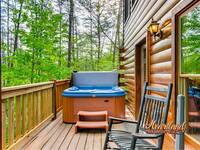 Relax in the outdoor hot tub of this 1 bedroom Gatlinburg cabin rental
