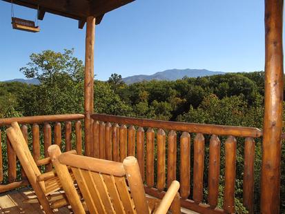 Rocking chairs on the porch of this luxury cabin