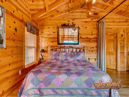 King size bedroom of this 3 bedroom cabin between Pigeon Forge and Gatlinburg