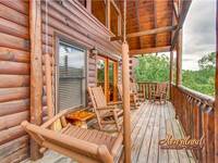 Back deck with rocking chairs and porch swing