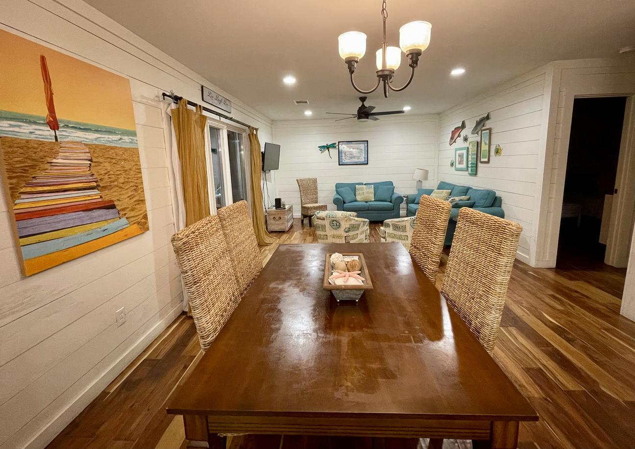 Dining area with large table and coastal decor in Rockport vacation rental