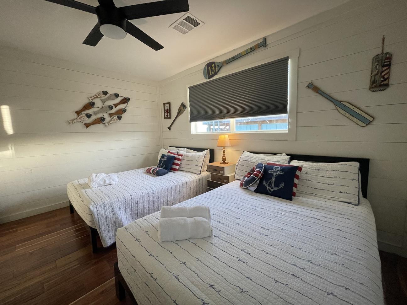 The 2nd bedroom has a smart TV and ceiling fan.
