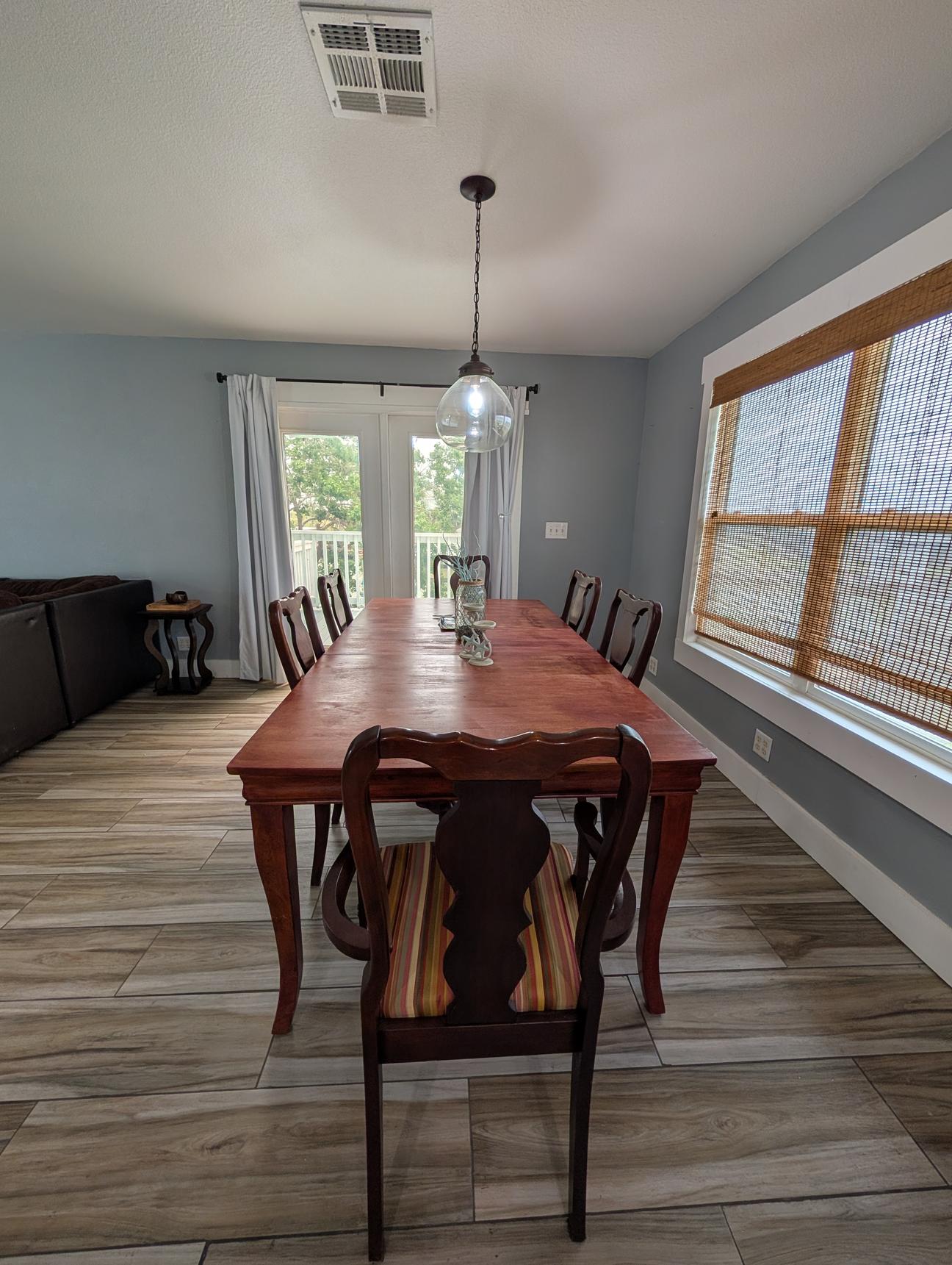Large wooden dining table with seating for eight. 