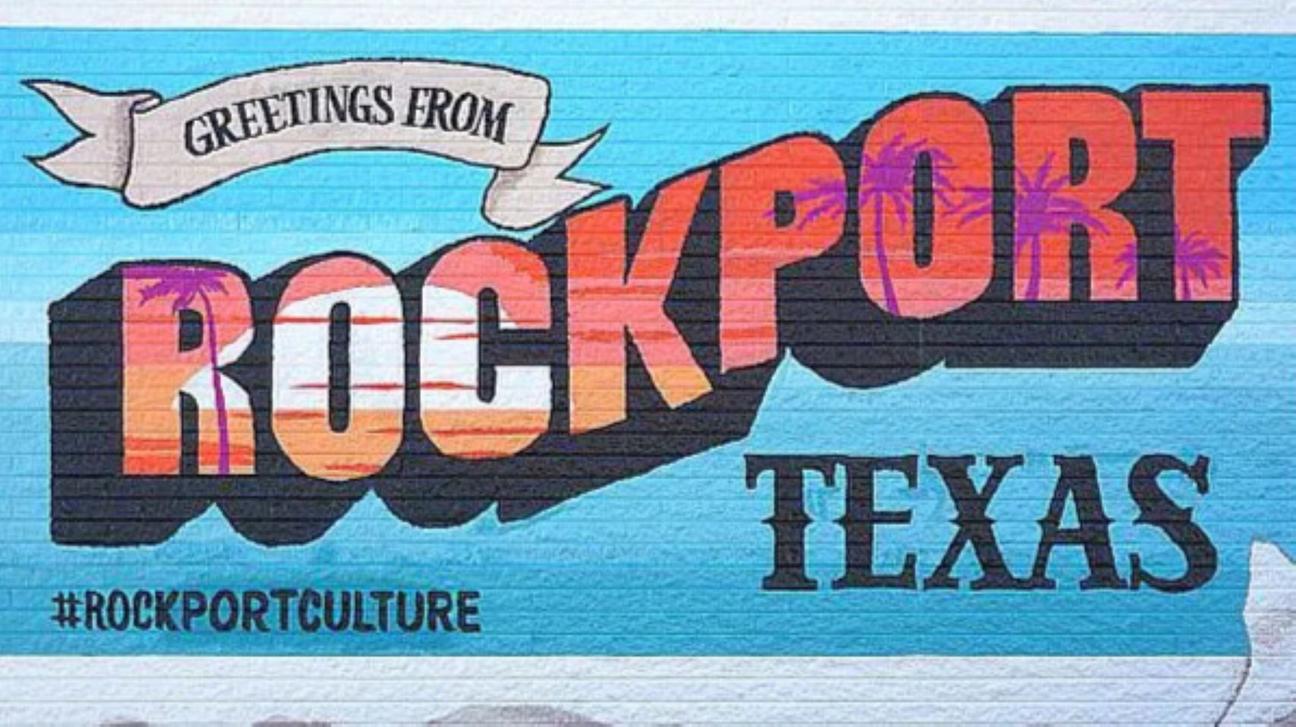 Colorful mural reading “Greetings from Rockport Texas” with hashtag #RockportCulture on a blue background.