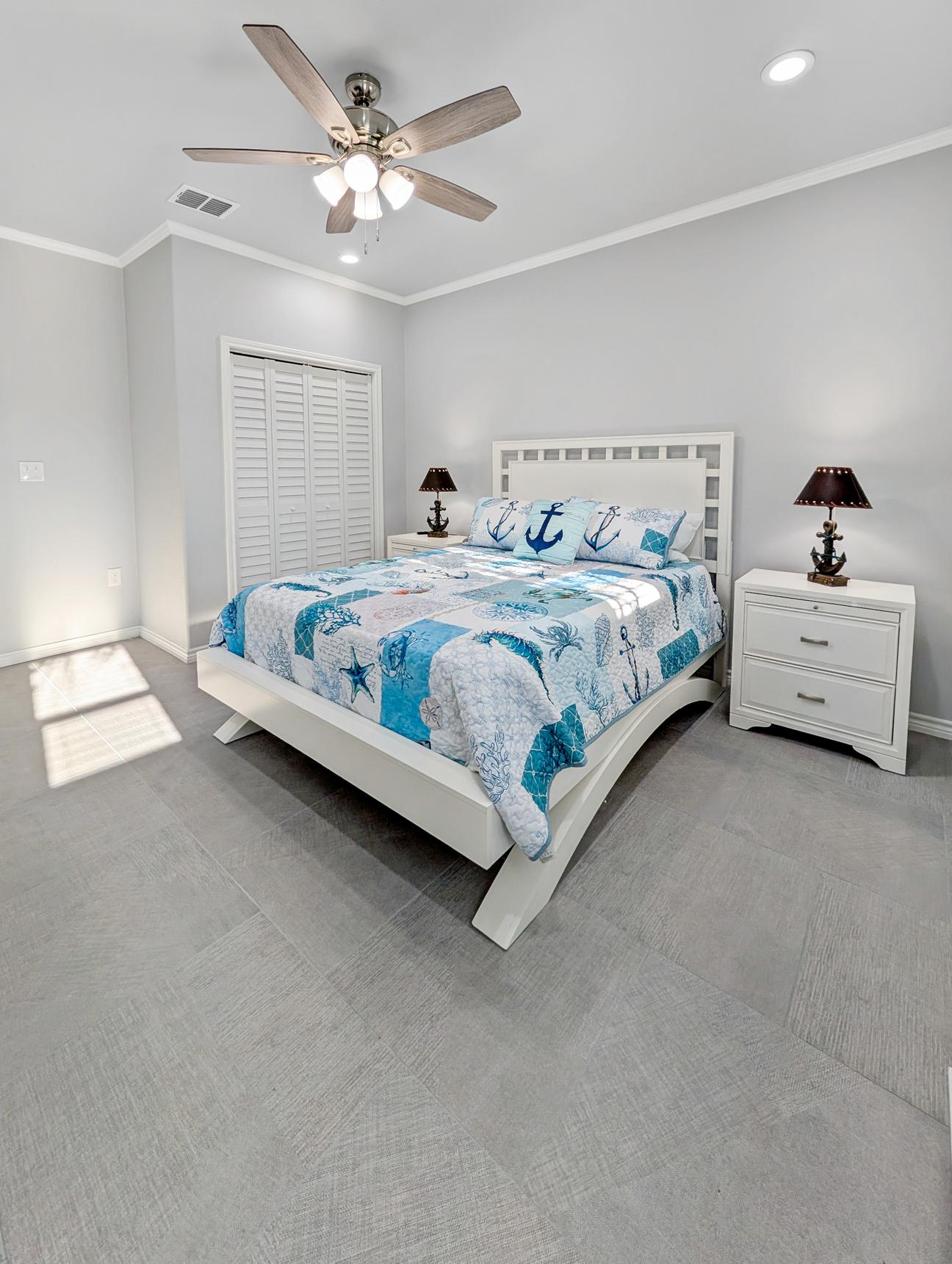 Large king bed in bright bedroom