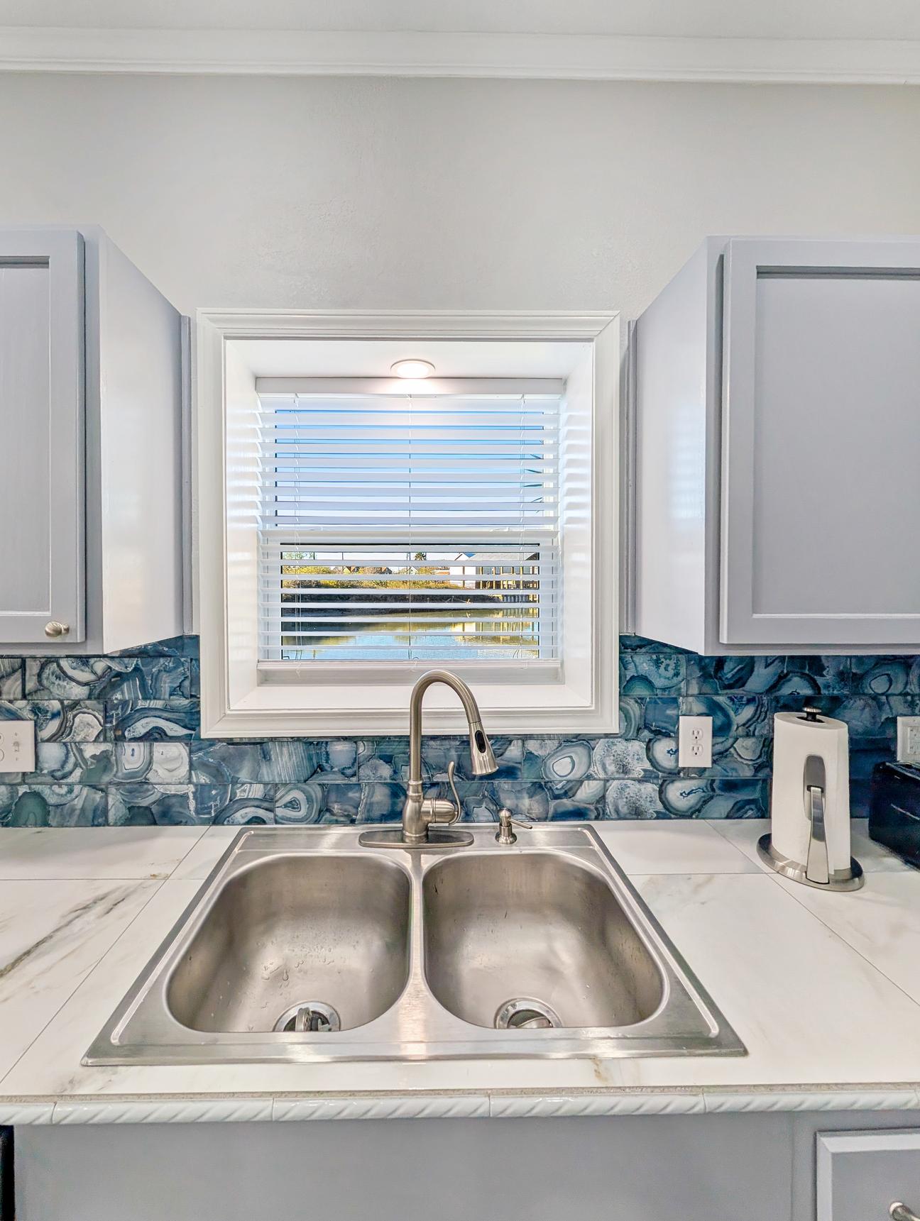 Sink,, cupboards, water view out the window