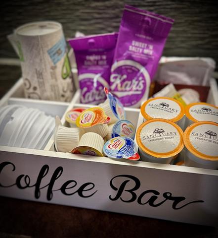 STOCKED COFFEE CADDY & BOTTLED WATER INCLUDED WITH EVERY STAY AT SANCTUARY TREEHOUSE RESORT
