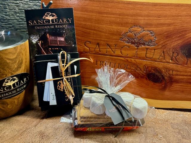 YOUR CHECK IN PACKET AWAITS IN YOUR TREEHOUSE WITH DISCOUNTS, FREEBIES, & GIFTS FROM SANCTUARY TREEHOUSE RESORT TREEKEEPERS