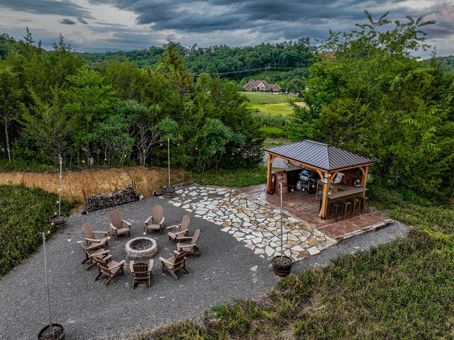 SANCTUARY TREEHOUSE RESORT COMMUNITY GATHERING SPACE - FIRE PIT AND OUTDOOR KITCHEN
