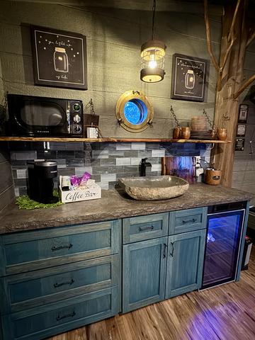 KITCHENETTE IN CHASING FIREFLIES TREEHOUSE - MICROWAVE - KEURIG COFFEE MAKER - STOCKED COFFEE CADDY - ICE BUCKET - DRINK CHUTE - MINI FRIDGE AND MORE...