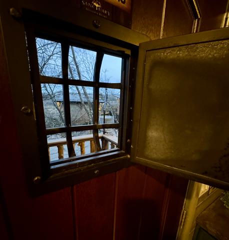 A PEEK THROUGH THE SPEAK EASY DOOR AT CHASING FIREFLIES TREEHOUSE - SLEEPS 6