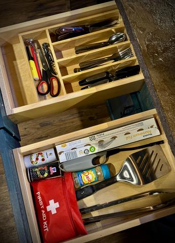 UTENSILS, WINE TOOL, SCISSORS, FIRST AID KIT WITH EXTRA BATTERIES, SEASONING, GRILL TOOLS, AND MORE PROVIDED