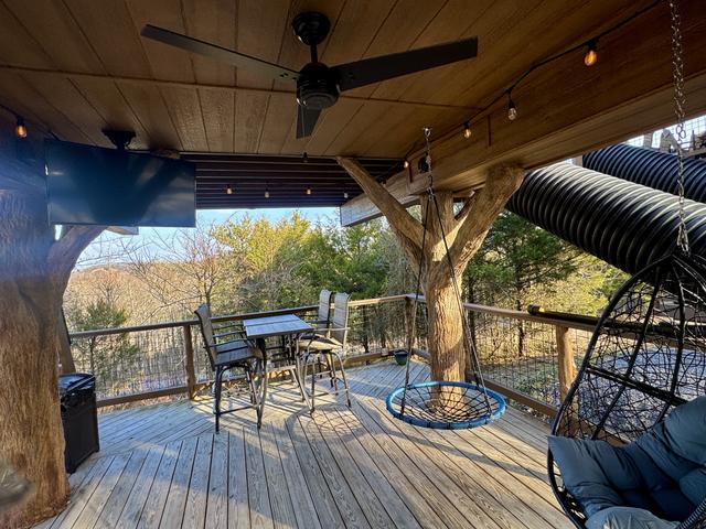 2 LOWER DECKS - SWINGS - 2 ROPE CLIMBS - 2 ESCAPE HATCHES - 2 SECRET LADDERS - TWO 20-FOOT SLIDES - TWO 50" TV'S - 2 DRINK CHUTES AND MORE