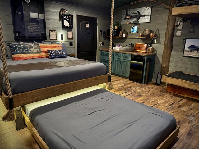 TURN THE WHEEL ON THE WALL AND REVEAL A SECRET ROLL OUT QUEEN BED - LUXURY LINENS PROVIDED