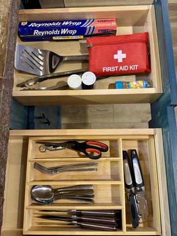 STOCKED KITCHEN DRAWERS - ALL THE ESSENTIALS ARE PROVIDED - SOAPS, CLEANERS, FIRST AID KIT, WINE TOOL, SCISSORS, SEASONING, GRILL TOOLS, AND MORE
