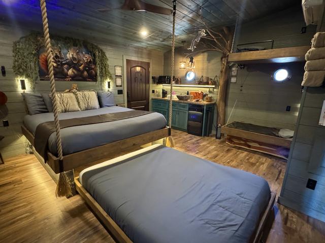 SECRET ROLL OUT QUEEN BED - SIMPLY TURN THE WHEEL ON THE WALL FOR THIS INTERACTIVE FEATURE - LUXURY LINENS PROVIDED