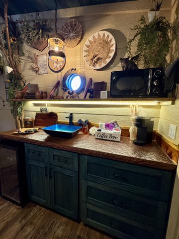 STOCKED KITCHENETTE - MICROWAVE - MINI FRIDGE - KEURIG COFFEE MAKER - COMPLIMENTARY K-CUPS - STOCKED COFFEE BAR - SERVICE WARE - COOKING/CLEANING SUPPLIES - FIRST AID KIT - AND MORE