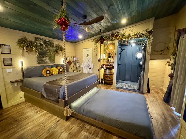 ROPE SUSPENDED KING BED WITH SECRET ROLL OUT QUEEN BED - LUXURY LINENS PROVIDED