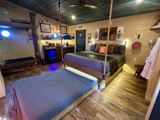 ROLL OUT SECRET QUEEN BED - TURN THE INTERACTIVE FEATURE WHEEL - LUXURY LINENS PROVIDED