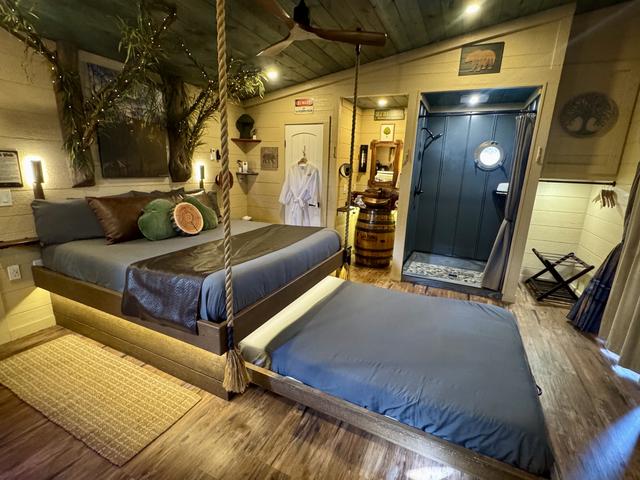 SECRET ROLL-OUT QUEEN BED - TURN THE WHEEL ON THE WALL FOR AN INTERACTIVE FEATURE - LEFT SIDE TREEHOUSE BEDROOM - LUXURY LINENS PROVIDED