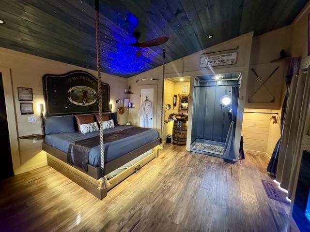 ROPE SUSPENDED KING BED ROOM VIEW - 19TH HOLE TREEHOUSE AT SANCTUARY TREEHOUSE RESORT