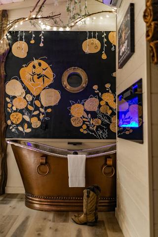 INDOOR COPPER TUB - CHAMPAGNE BUCKET - CUSTOM ART WALL MURAL WITH HIDDEN WORD (SLAY) - LED FIREPLACE - TOWEL WARMER - LUXURY LINENS & BUBBLE BATH PROVIDED