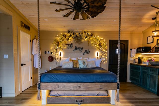 ROPE SUSPENDED KING BED - HONEY HOLE LUXE TREEHOUSE - SLEEPS UP TO 4 - SANCTUARY TREEHOUSE RESORT IN THE SMOKY MOUNTAINS